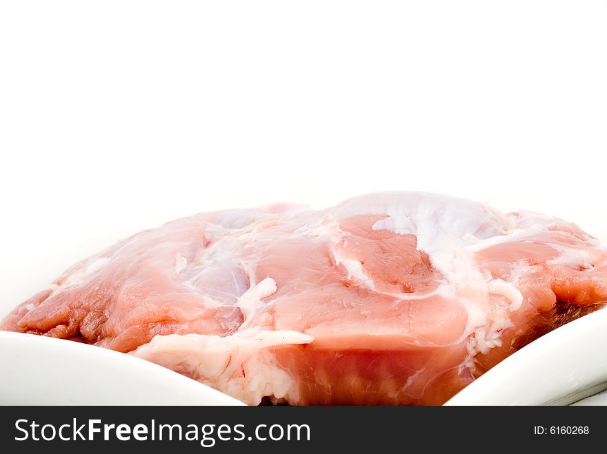 Piece of fresh meat isolated on white background