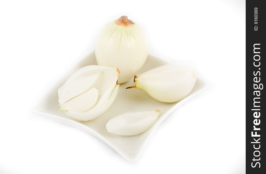 Sliced onion in white plate isolated on background