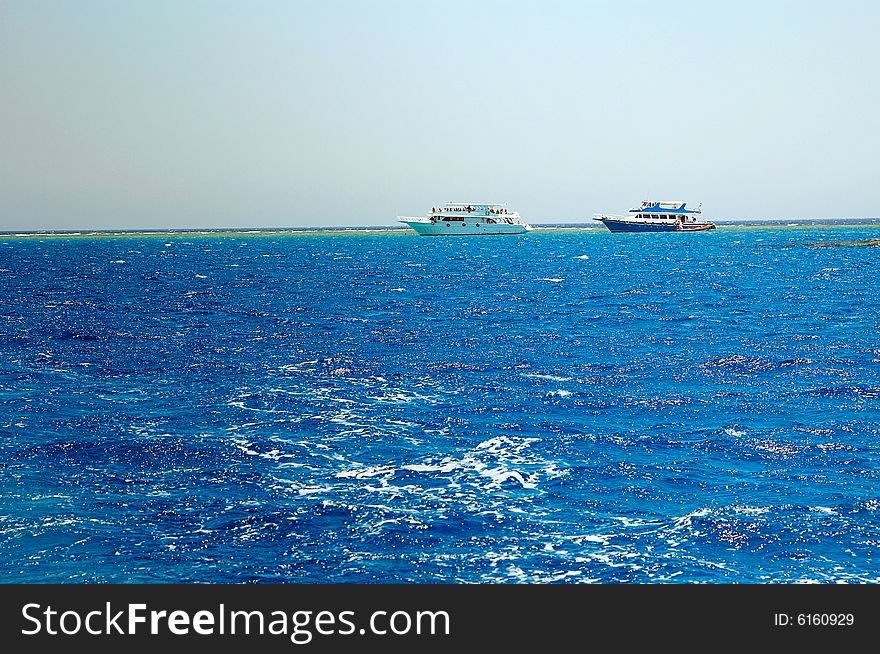 Two ships next to reefs  in the Red sea. Two ships next to reefs  in the Red sea.