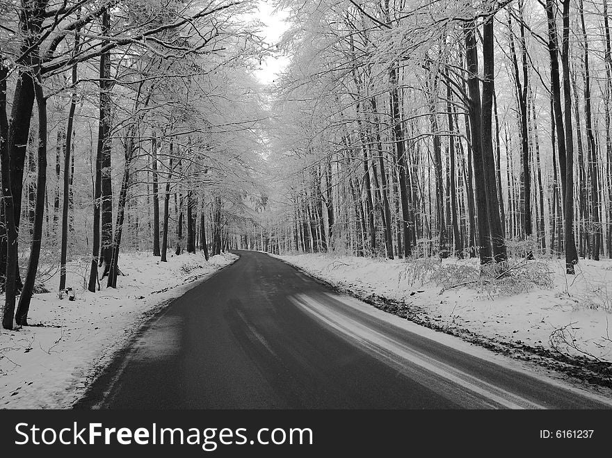 Road in the warm winter,a few snow round Brno city