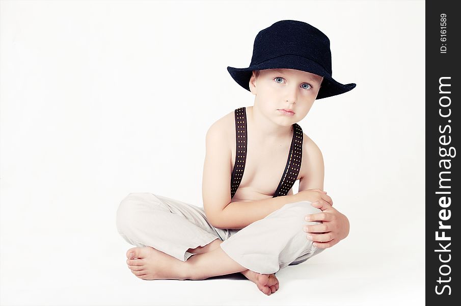 Portrait of little boy in the black hat