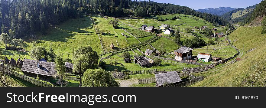 Rural landscape with lush green fields and farm house