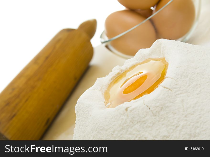 Rolling pin,eggs and flour. Rolling pin,eggs and flour