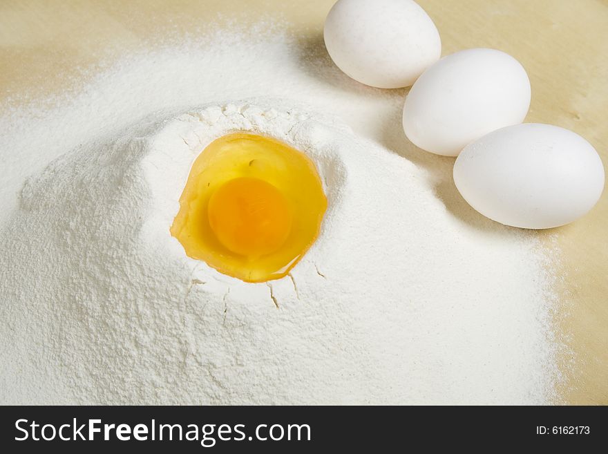 Eggs and flour on table