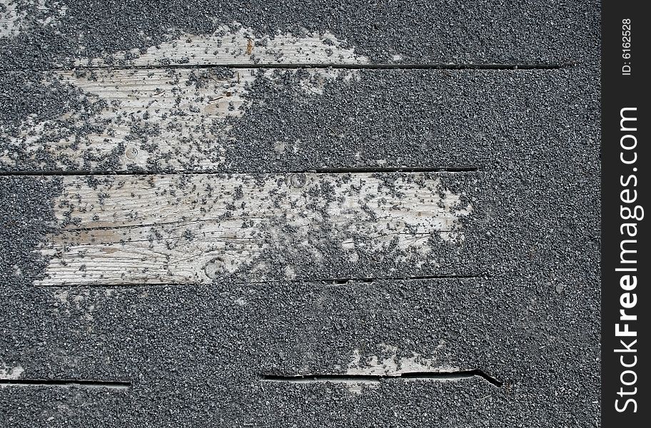 Detail of rock texture on wooden slat