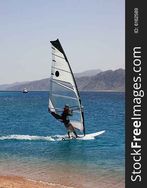 Camera-man-windsurfer in Dahab. Red Sea, Egypt. Camera-man-windsurfer in Dahab. Red Sea, Egypt.