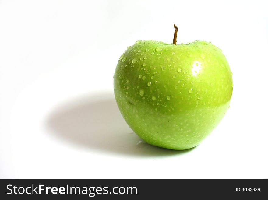 One green apple on a white background