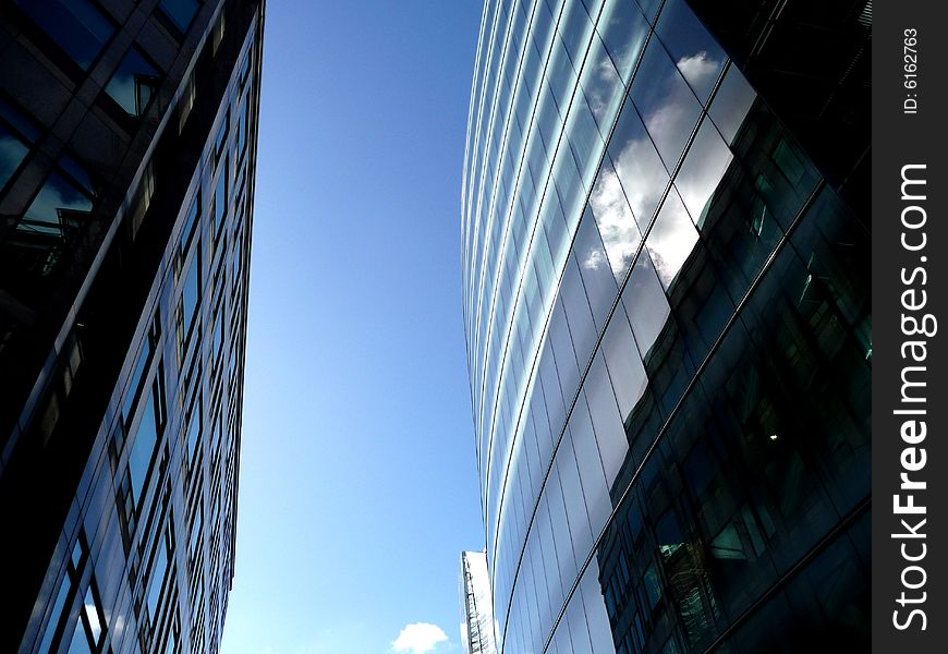 An abstract view of the glass windows of a modern building. An abstract view of the glass windows of a modern building.