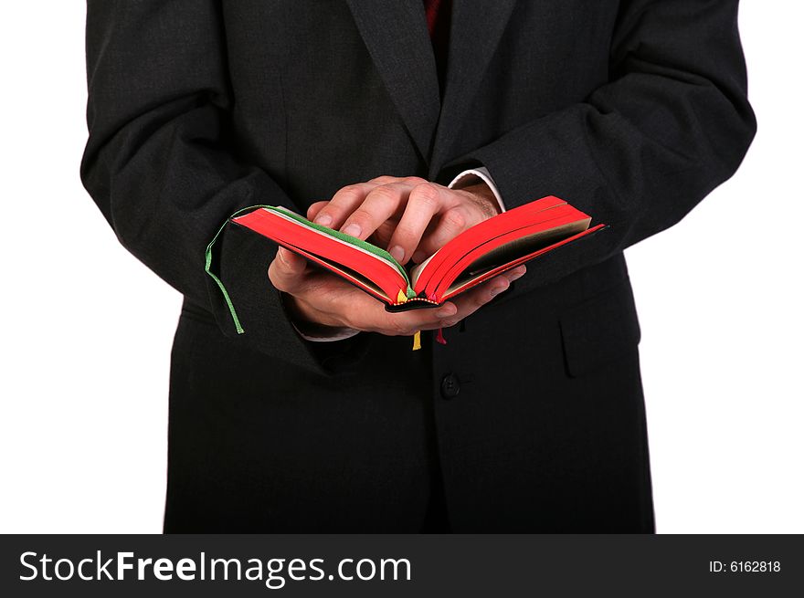 Man in suit holding bible in his hands. Man in suit holding bible in his hands