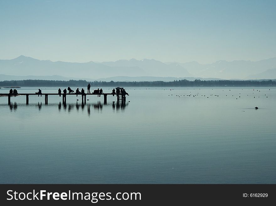 People on a footbridge (morning, Starnberger lake, Bavaria, Germany)