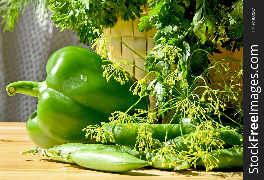 Green tasty pepper on a table