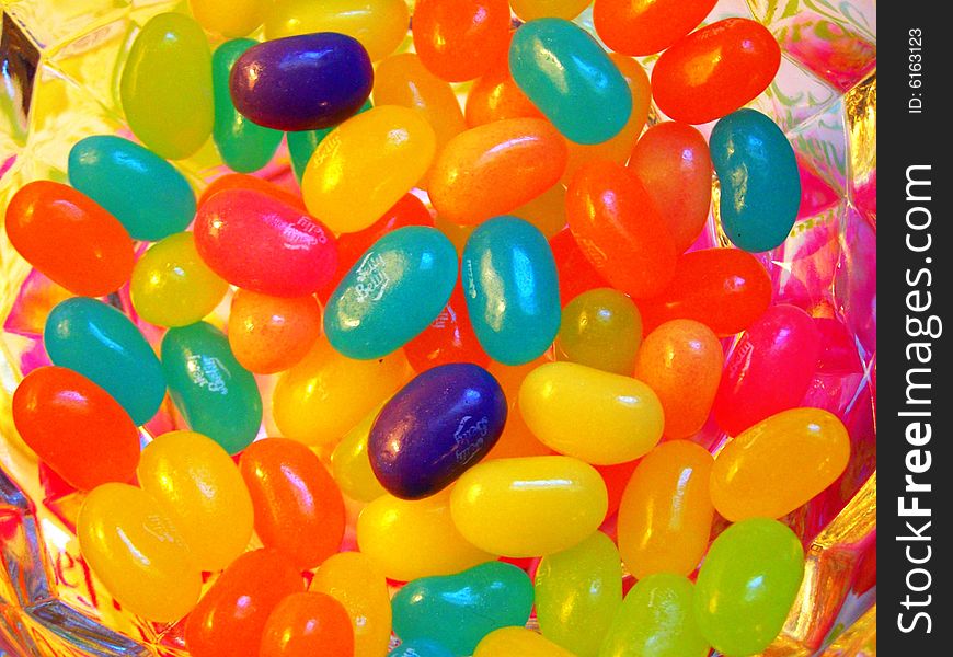 Many multi-coloured sweets in a vase