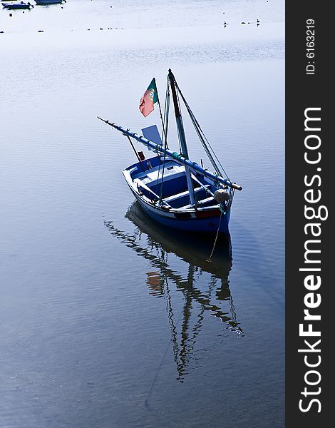 Portuguese fishing boat with beautiful reflection.