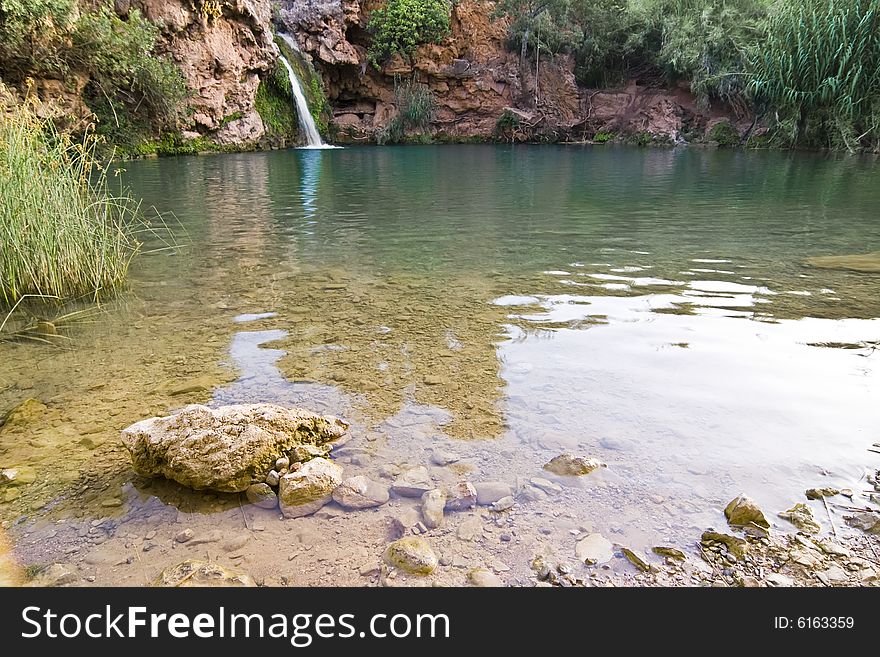 Eautiful waterfall in hidden secret lagoon. Eautiful waterfall in hidden secret lagoon.