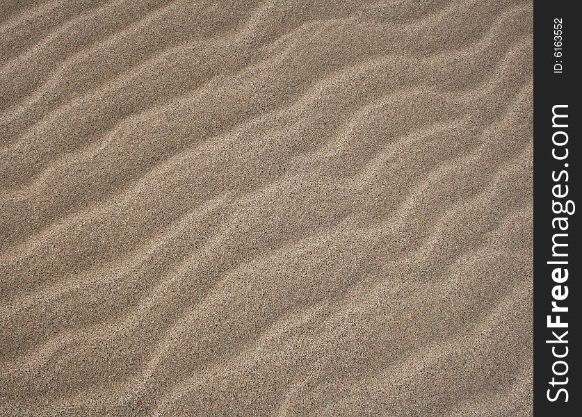 Wave patterns on a sand beach. Wave patterns on a sand beach.