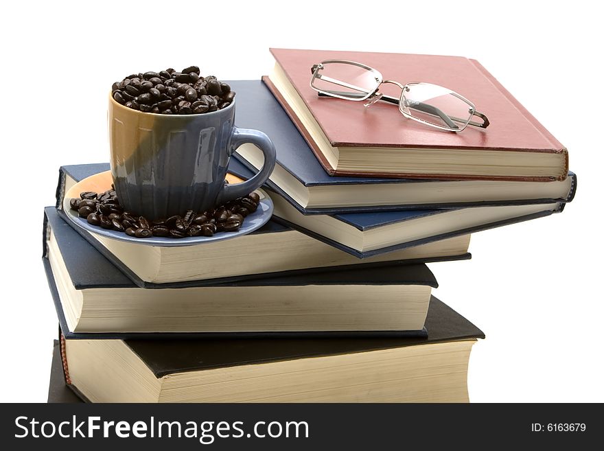 Stack of books and a cup of coffee. Stack of books and a cup of coffee