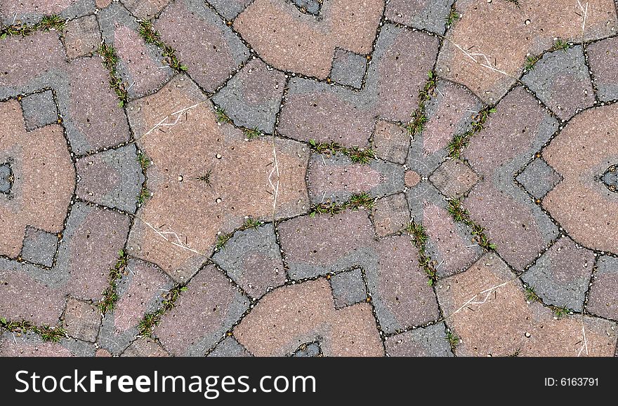 A seamless pattern background made out of stone slabs on the ground. A seamless pattern background made out of stone slabs on the ground.