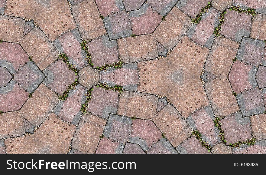 A seamless pattern background made out of stone slabs on the ground. A seamless pattern background made out of stone slabs on the ground.