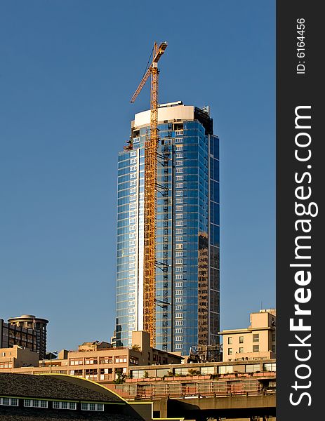 New construction and tower crane in downtown Seattle Wa. New construction and tower crane in downtown Seattle Wa