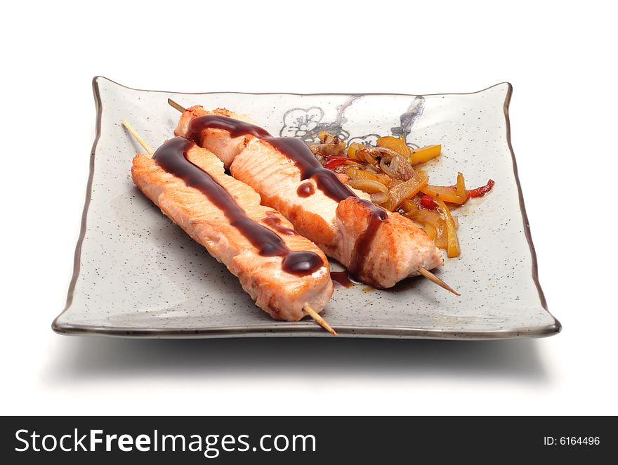 Japan Plate of Shish Kebab from Salmon and Vegetables. Isolated on White Background. Japan Plate of Shish Kebab from Salmon and Vegetables. Isolated on White Background