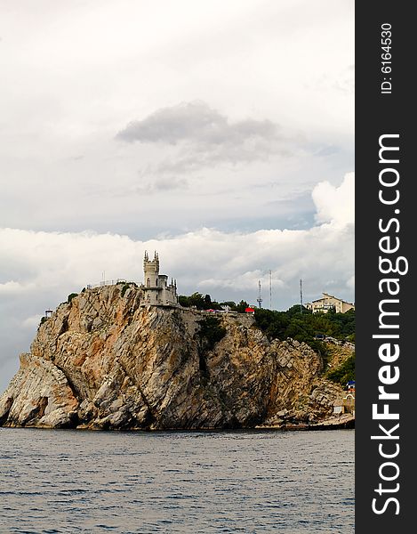 The castle in the Gothic style on cliff. The castle in the Gothic style on cliff