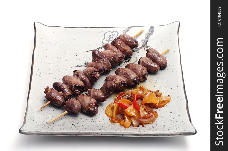 Japan Plate of Shish Kebab from Chickens Heart and Vegetables. Isolated on White Background. Japan Plate of Shish Kebab from Chickens Heart and Vegetables. Isolated on White Background