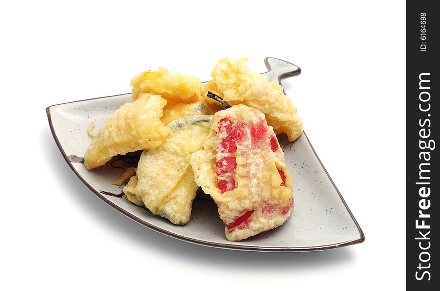 Japan Plate of Vegetables in Tempura Pastry. Isolated on White Background. Japan Plate of Vegetables in Tempura Pastry. Isolated on White Background