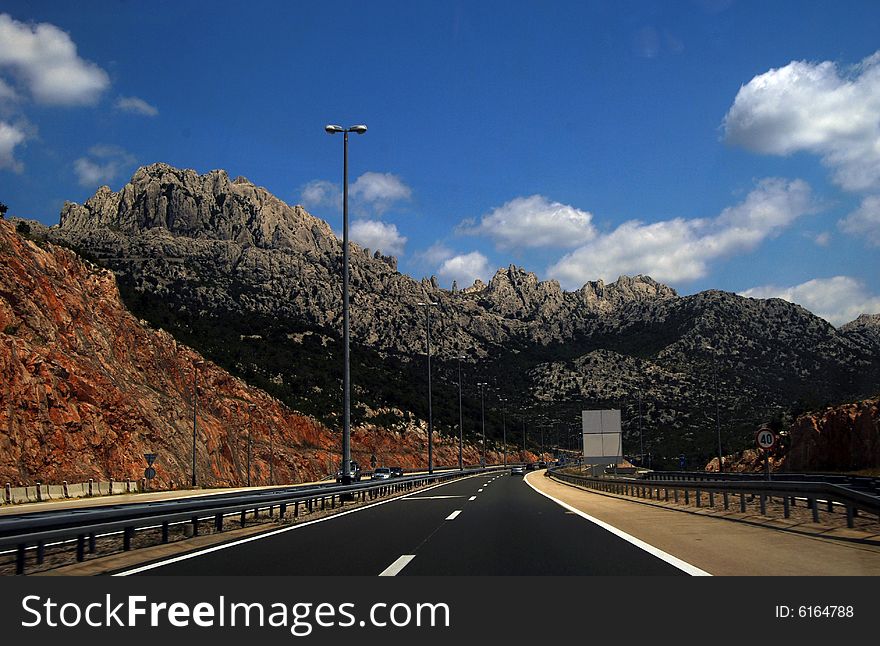Motorway crossing the rocky mountains of Dinaric Alps, Croatia, Dalmatian coast. Motorway crossing the rocky mountains of Dinaric Alps, Croatia, Dalmatian coast.
