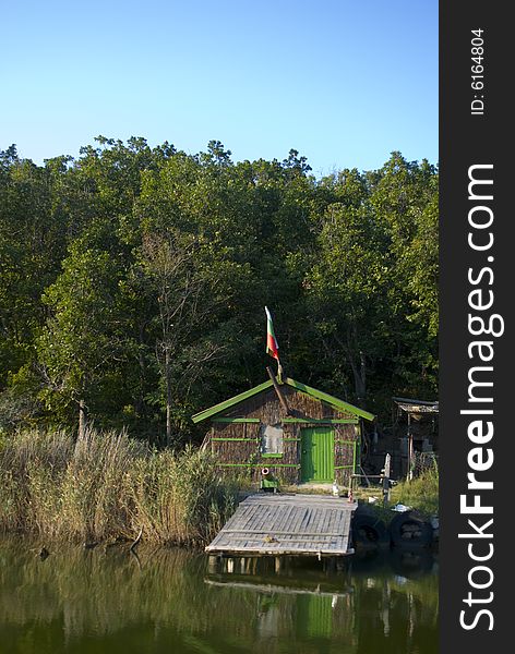 A small cottage on the river bank. A small cottage on the river bank