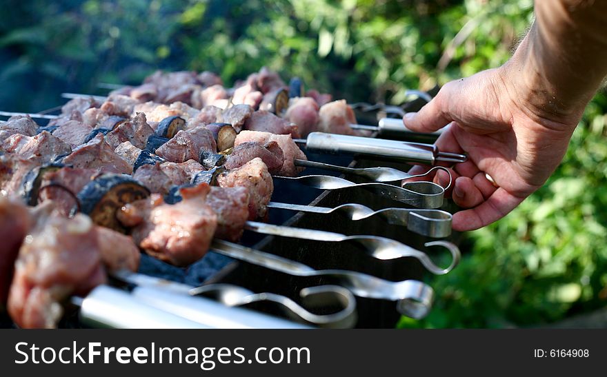 Chunks of meat cooking on barbeque grill. Chunks of meat cooking on barbeque grill
