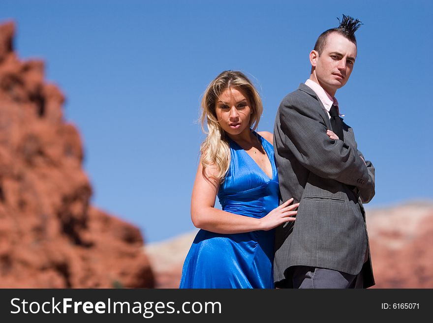 Attractive couple posing in fashionable dresses. Attractive couple posing in fashionable dresses