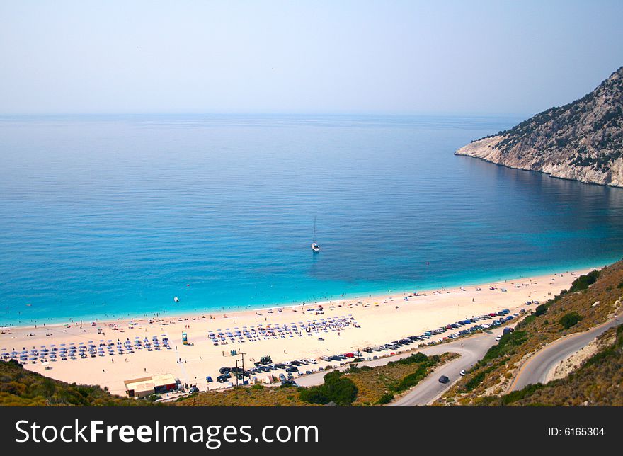 The beach of Myrtos , one of the top beaches in Europe , located in the island of Kefalonia in Greece. The beach of Myrtos , one of the top beaches in Europe , located in the island of Kefalonia in Greece