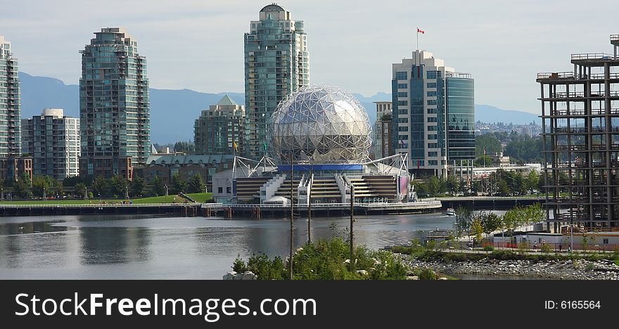 Waterfront with buildings, construction and theater. Waterfront with buildings, construction and theater.