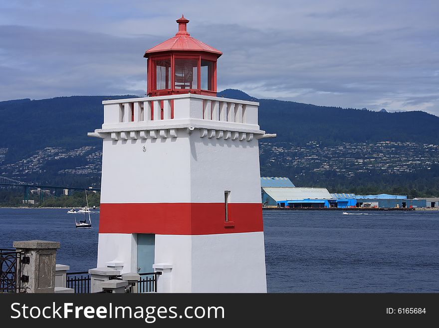 Red and white lighthouse on Vancouver harbor in British Columbia Canada. Red and white lighthouse on Vancouver harbor in British Columbia Canada.