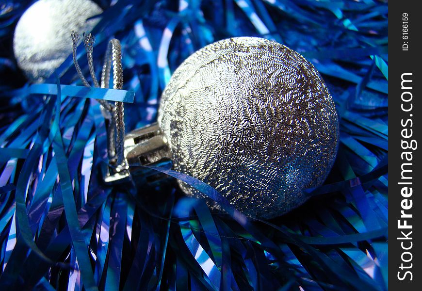 New Year's silver toys and blue decoration. New Year's silver toys and blue decoration