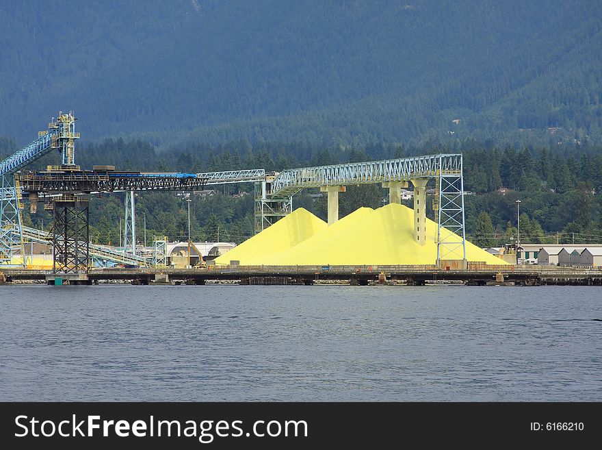 Sulpher Piles waiting to be loaded on to ships on the Waterfront. Sulpher Piles waiting to be loaded on to ships on the Waterfront.