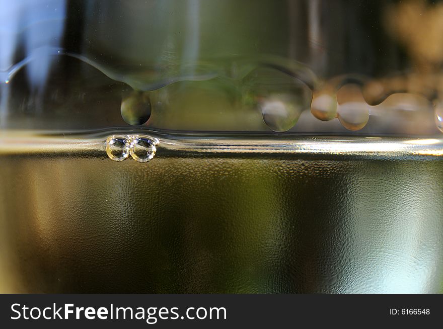 Closeup of a glass of white wine with legs