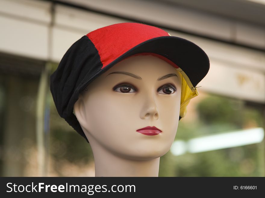 Close-up image of a mannequin of a young person with a hat. Close-up image of a mannequin of a young person with a hat
