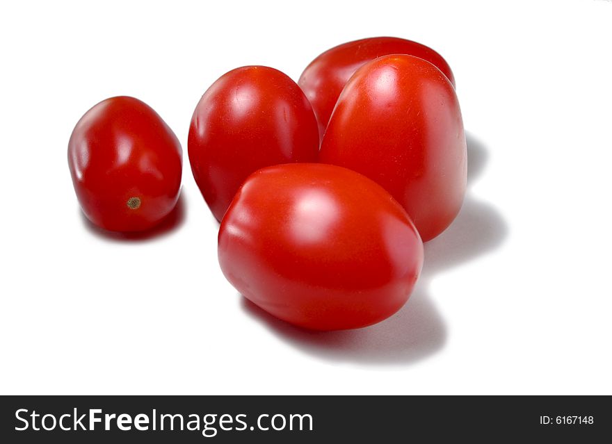 Five tomatoes isolated on white