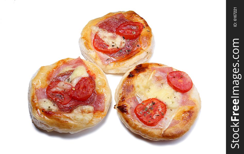 Three salt pizza cakes with tomato and salami isolated