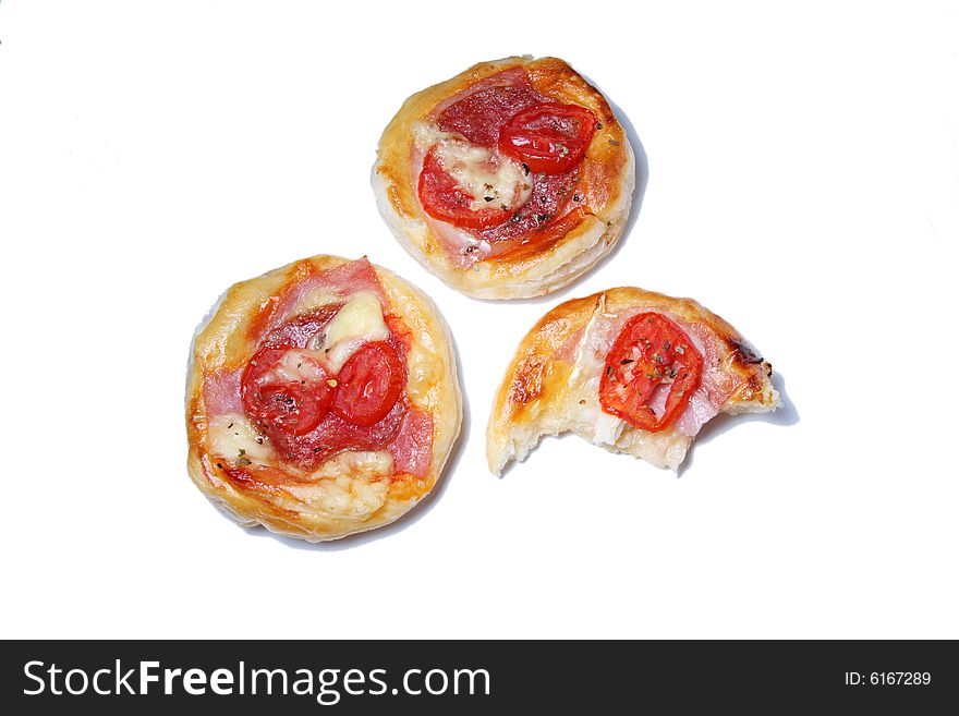 Salt pizza cake with tomato and salami bitten. Salt pizza cake with tomato and salami bitten