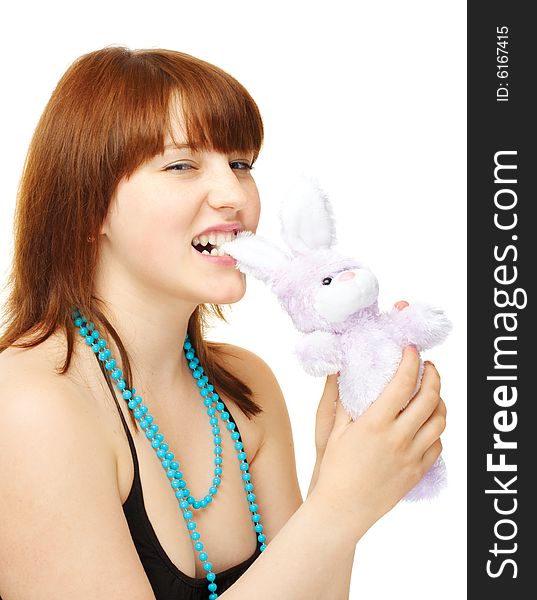 Angry young girl with toy bunny over white