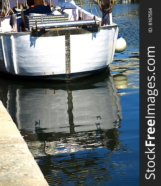 A suggestive shot of a stern reflected in the canal. A suggestive shot of a stern reflected in the canal