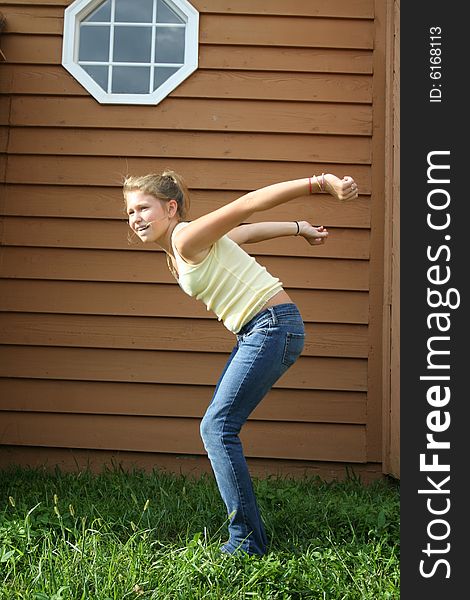 Photo of a 12 year old beautiful girl getting ready to jump. Photo of a 12 year old beautiful girl getting ready to jump