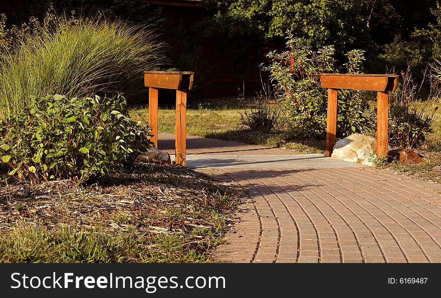 Picture of a brick walkway with handrails. Picture of a brick walkway with handrails