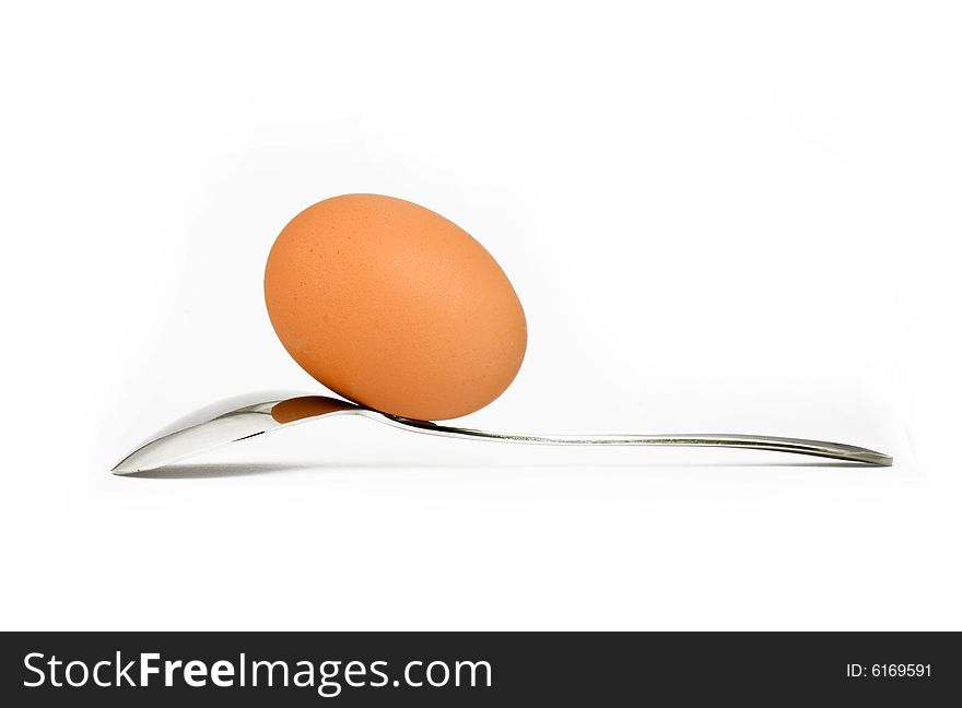 Egg and spoon isolated on a good position