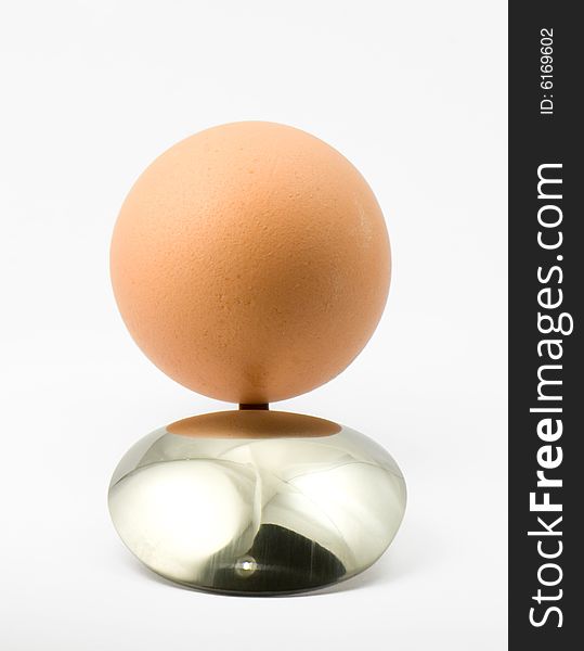 Egg and spoon isolated on a good position. Egg and spoon isolated on a good position