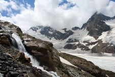 Waterfall In High Mountains Stock Photos