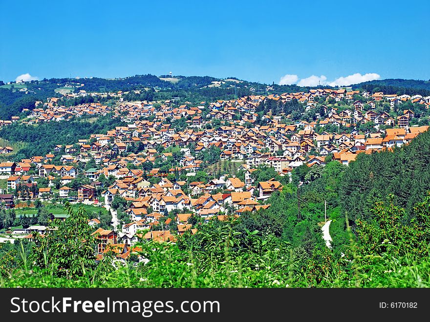 Rural landscape of serbian village,green hill and blue sky