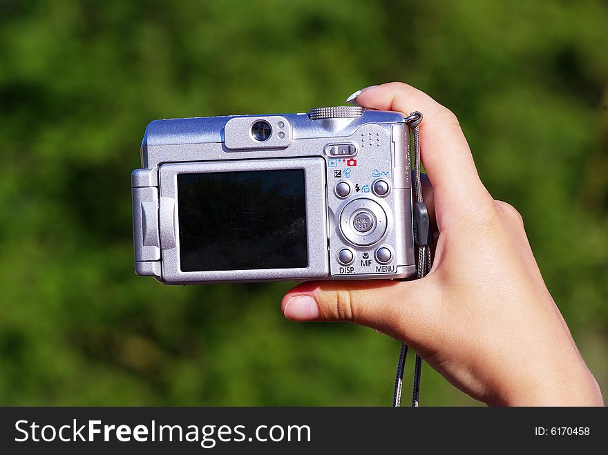 Digital camera in a hand